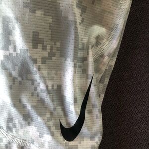 White/gray camo Nike compression pants.